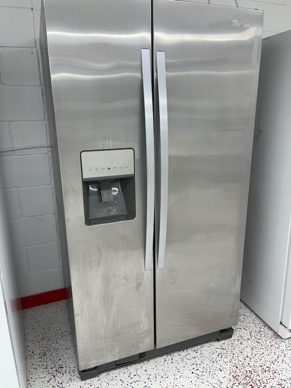 Used Whirlpool 24.6 cubic ft Side by Side refrigerator with ice and water in the door